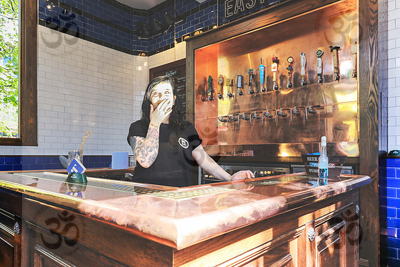 Tattooed city barmaid